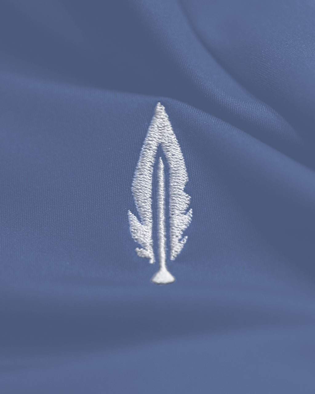 Feather and hide golf logo on a blue background