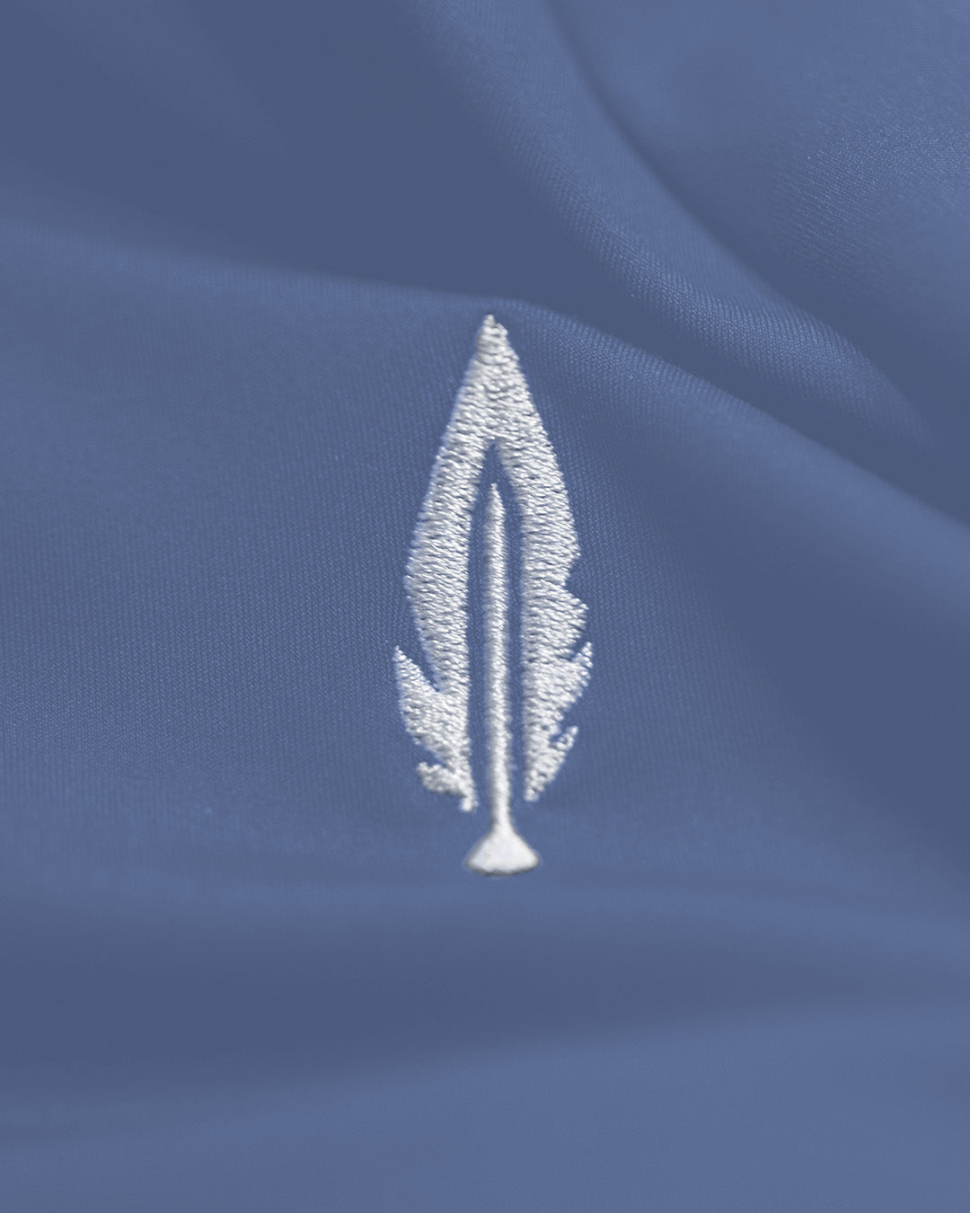 Feather and hide golf logo on a blue background