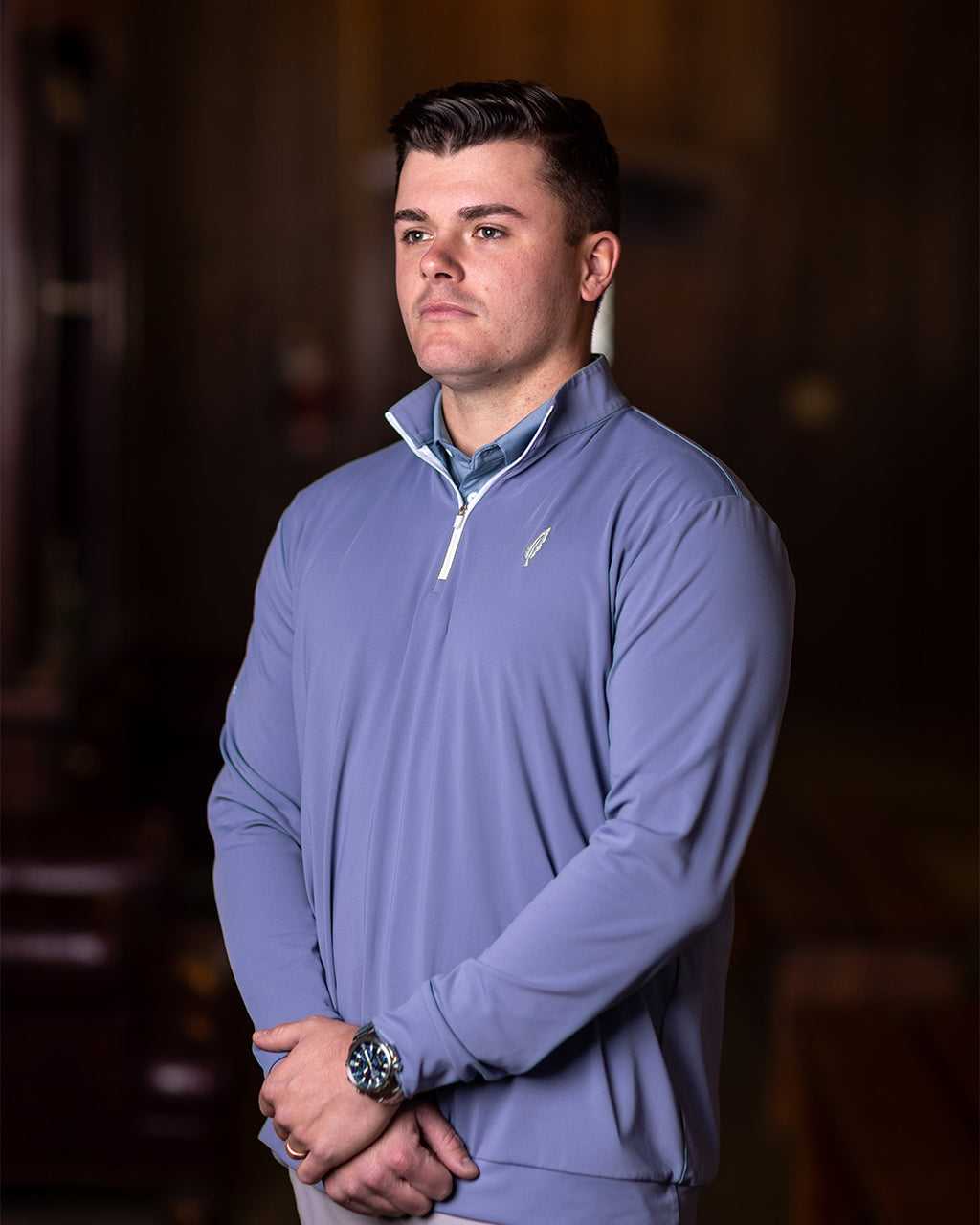 golfer wearing feather and hide golf quarter zip