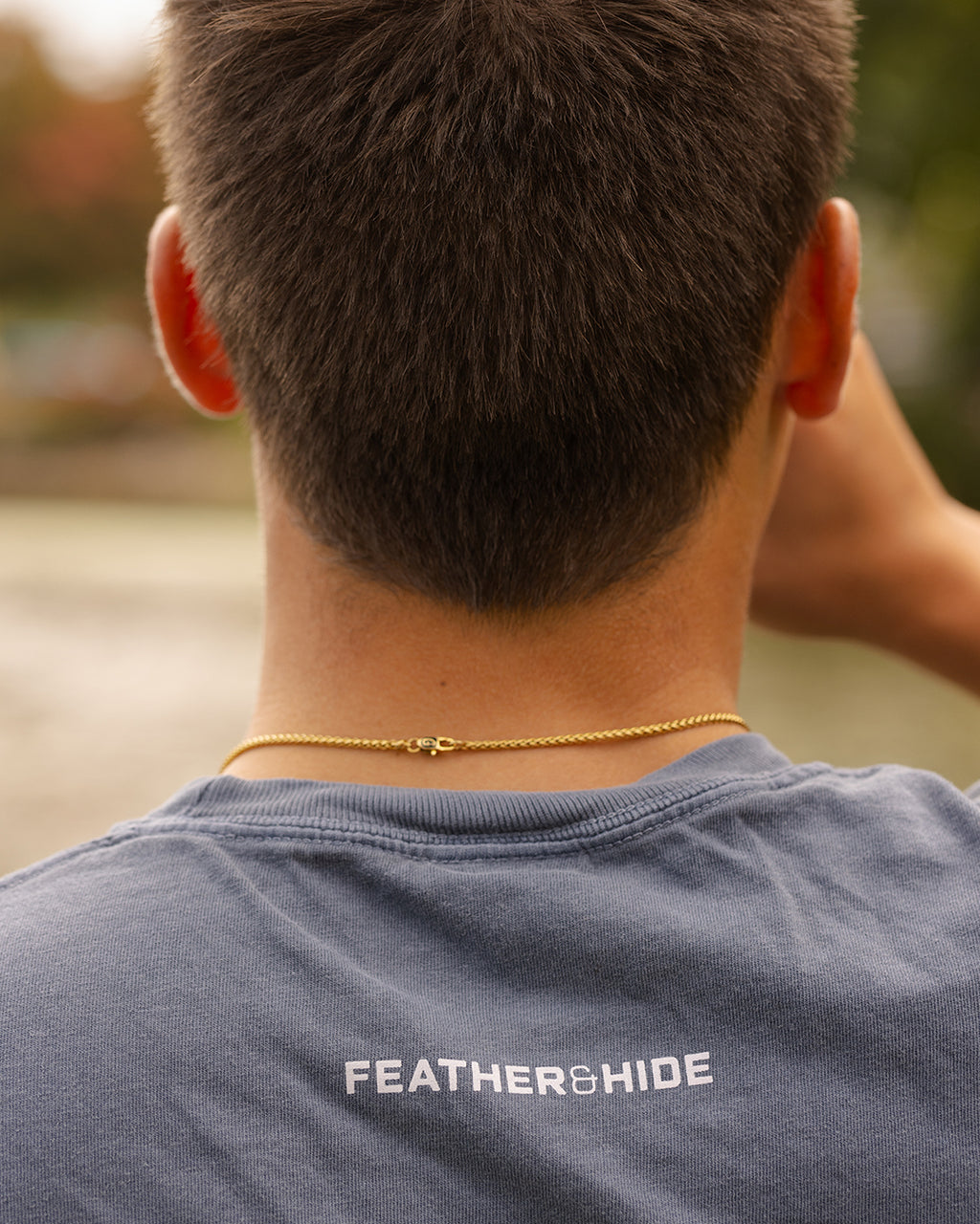 Feather and Hide on a blue tshirt